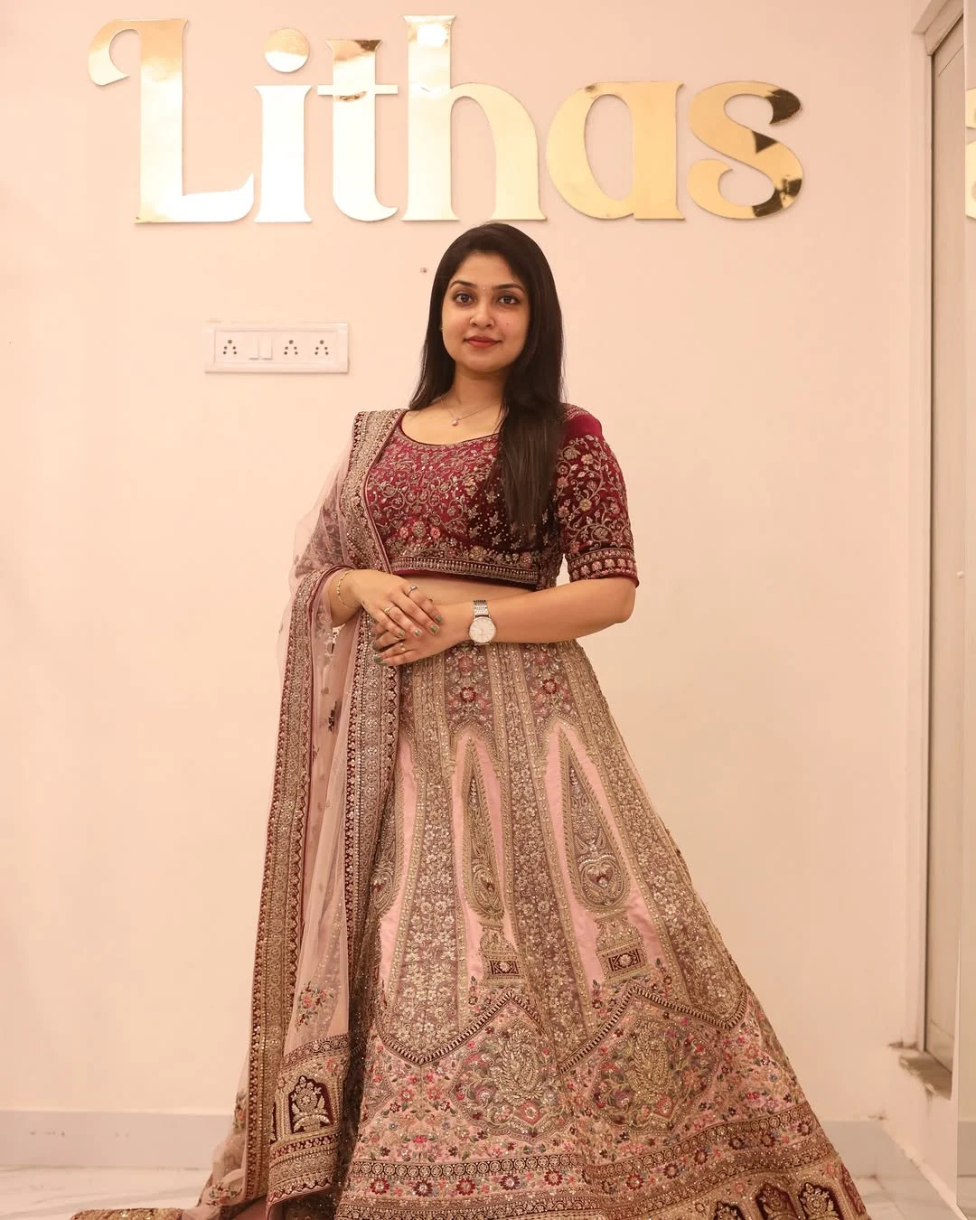 Bride in an elegant rental lehenga from Lithas